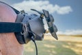 Man with FPV HD goggles, piloting racing drone Royalty Free Stock Photo