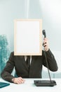 Sign-man in office answering phone Royalty Free Stock Photo