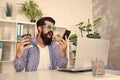 Man freak crazy office manager having phone call while drinking coffee. Productive day. Freak managing projects Royalty Free Stock Photo