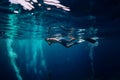 Man free diver swimming in ocean, underwater photo with diver