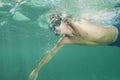 Man free diving and snorkeling on a coral reef