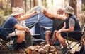 Man, friends and camping with cheers to coffee in nature for travel, adventure or summer getaway on chairs by tent in Royalty Free Stock Photo