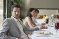 Man With Friends Having Formal Dinner Party