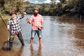 Man friends. Portrait of cheerful senior man fishing. Grandfather and son fishermans. Young man and an old man fishing