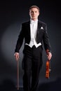 Man In Frock Coat With Violin Royalty Free Stock Photo