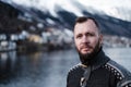 Man in front of beautiful town of Odda, Norway