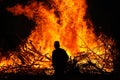 Man in front of a bonfire