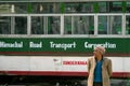 Man in front of local Indian bus