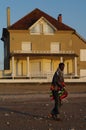 A man in front of a modern house