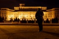 Man in front of Palace of Parliament, Bucharest, Romania