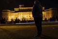 Man in front of Palace of Parliament, Bucharest, Romania Royalty Free Stock Photo