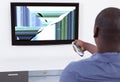 Man In Front Of Television Showing Distorted Screen