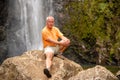 man in front of waterfall, Ile de la Reunion Royalty Free Stock Photo