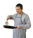 Man with frying pan cooking Royalty Free Stock Photo