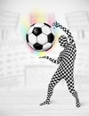 Man in full body suit holdig soccer ball