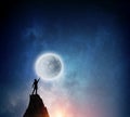 Man and full moon . Mixed media Royalty Free Stock Photo