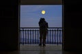 Man with full moon night at the terrace Royalty Free Stock Photo