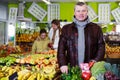 man with full shopping cart in fruit market Royalty Free Stock Photo