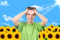 The man in a garden. Sunflower Royalty Free Stock Photo