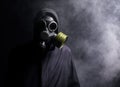 A man in a gas mask in the smoke Royalty Free Stock Photo