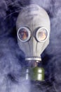 Man is in Gas Mask with Smoke around Royalty Free Stock Photo