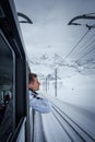 Man in Winter Jacket on Alpine Train, Zermatt Ski Resort Royalty Free Stock Photo