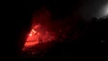 Man geologist with a red burning signal flare exploring underground dark cave, science concept. Stock footage. Scientist