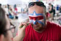 Man Gets Lafleur Symbol Painted On Face At Festival Royalty Free Stock Photo