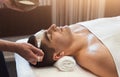 Man getting face mask by beautician at spa Royalty Free Stock Photo