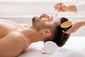 Man getting face treatment at spa salon Royalty Free Stock Photo