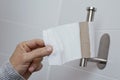 Man getting the last piece of toilet paper Royalty Free Stock Photo