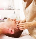 Man getting massage in thebeauty center Royalty Free Stock Photo