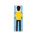 Man getting money from cash machine ATM . Cartoon male character in yellow sweater and black pants, back side. Banking Royalty Free Stock Photo