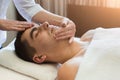 Man getting professional facial massage at spa salon Royalty Free Stock Photo