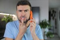 Man getting a suspicious phone call Royalty Free Stock Photo