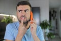 Man getting a suspicious phone call Royalty Free Stock Photo