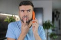 Man getting a suspicious phone call Royalty Free Stock Photo