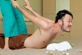Man getting traditional Thai massage ,stretching spine