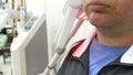Man getting UV heat treatment at clinic