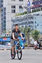 Man on a Giant mountain bike, downtown Kunming, China