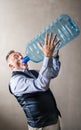 Man with a giant water bottle Royalty Free Stock Photo