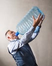 Man with a giant water bottle Royalty Free Stock Photo
