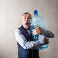 Man with a giant water bottle Royalty Free Stock Photo