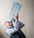 Man with a giant water bottle Royalty Free Stock Photo