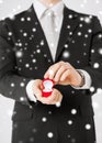 Man with gift box and wedding ring Royalty Free Stock Photo