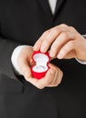 Man with gift box and wedding ring Royalty Free Stock Photo