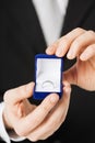 Man with gift box and wedding ring Royalty Free Stock Photo