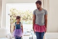 Man with girl, ballet dancing and teaching with learning at home in tutu, bond with love and creativity. Family, father Royalty Free Stock Photo