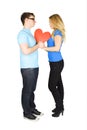 Man and girl holding red paper heart, isolated Royalty Free Stock Photo