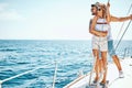 Man with girl in love on a sail boat in the summer